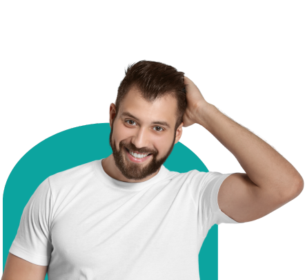 A doctor performs a hair transplant under a surgical lamp.